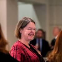Woman smiles at reception